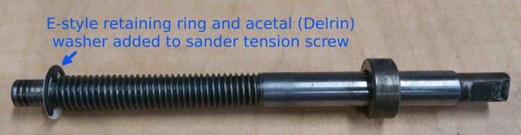 Tension screw modified to accept an E-style retaining ring & acetal (Delrin) washer to prevent wear of threads on inside of casting