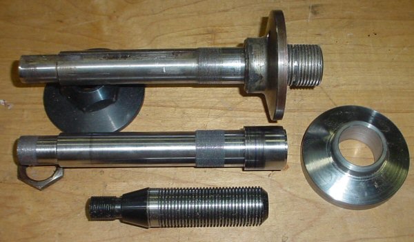 The arbor and flange (middle) before being pressed together. The original arbor is above and the arbor extension below.