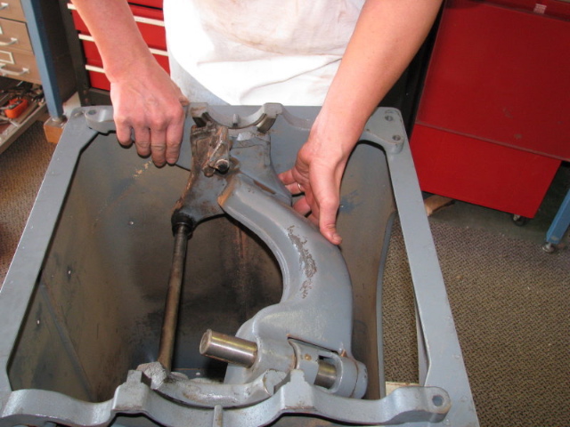 Separate the rear trunnion bracket from the yoke
