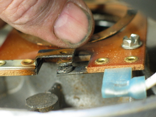 Here's the points that need filing, sanding, and otherwise smoothing out. Be careful not to bend the copper springs.