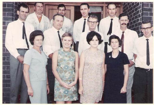 The Rockwell SA staff at the Kempston Road entrance Port Elizabeth. Back Row: Jan Smit, Bennie van Heerden, Ray Francis, Dennis Surgeson (Branch Manager Transvaal). Middle: Ronnie Nel, Doug Scott , Ernie Hoffman, Vic Thole (Branch Manager). Front: Unknown, Unknown, Diane Singer, Ellen Rankin, Alan Evenden.